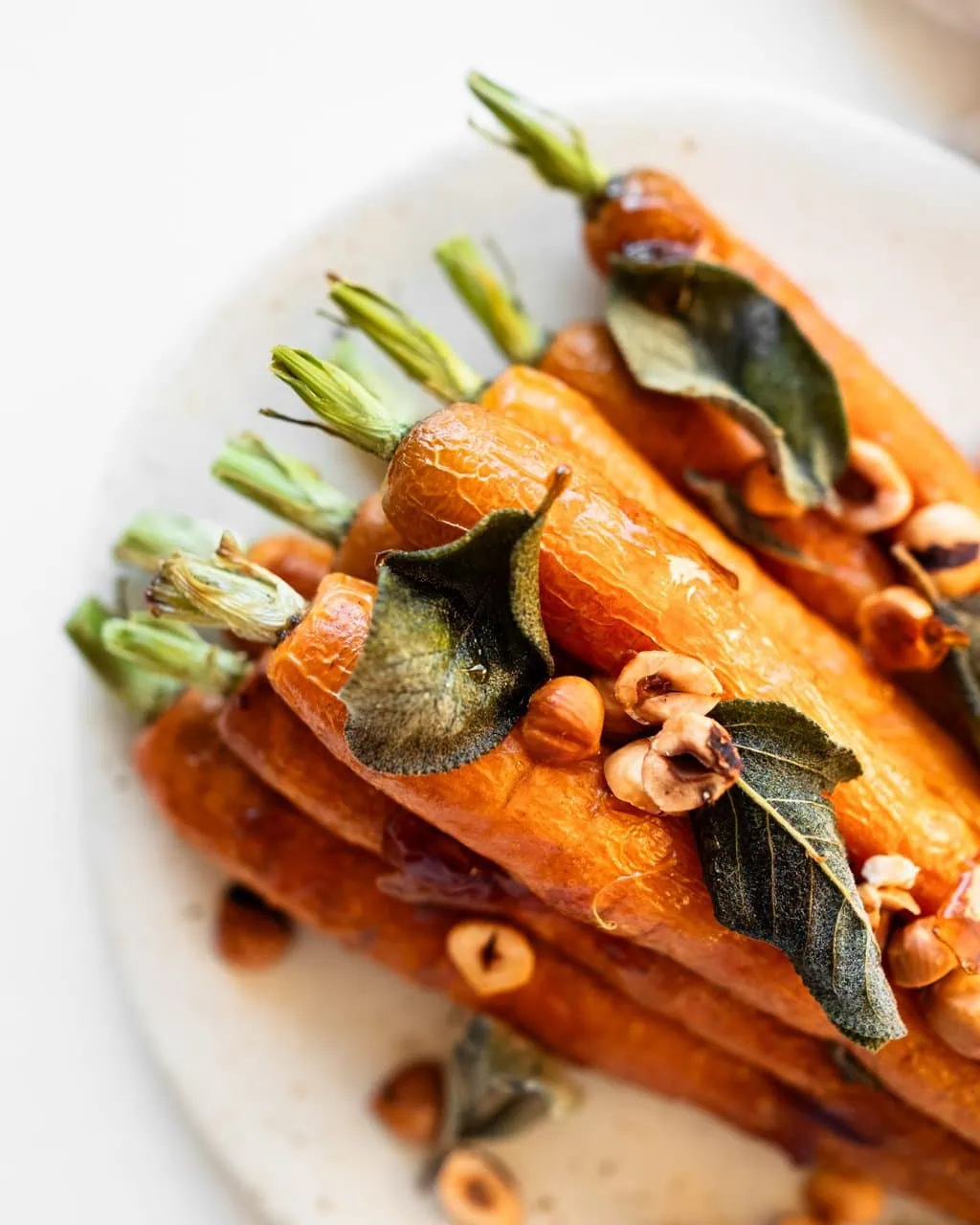 maple roasted carrot with sage from above close up